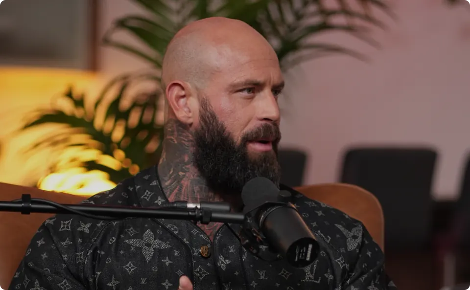 Studio A - Guest with tattoos at mic